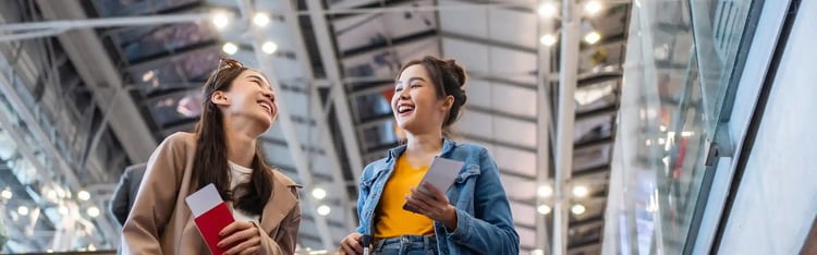asian-young-women-passenger-walk-in-airport-terminal-to-boarding