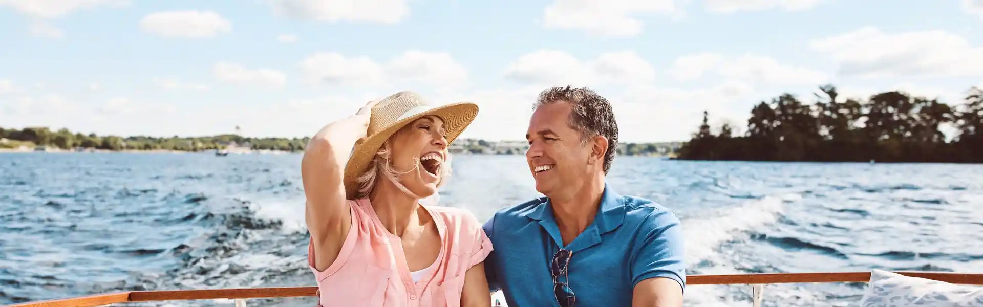 laughing--happy-couple-and-on-a-boat-for-retirement-travel-
