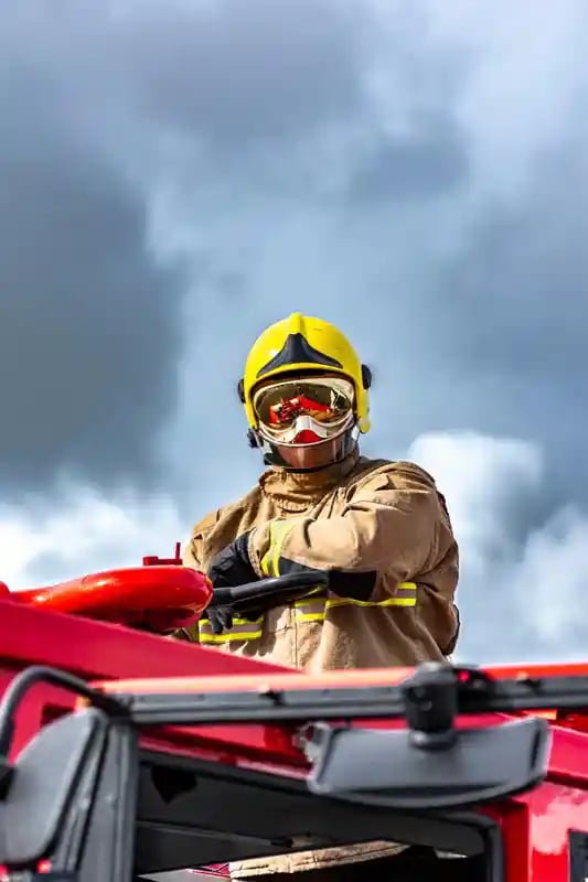 air-base-firefighters---portrait-atop-fire-engine
