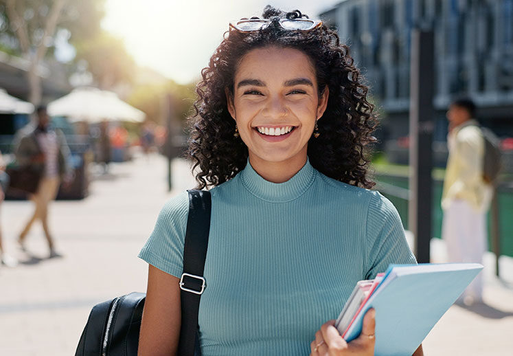 female-student-happy-to-be-an-international-student-with-travel-medical-insurance