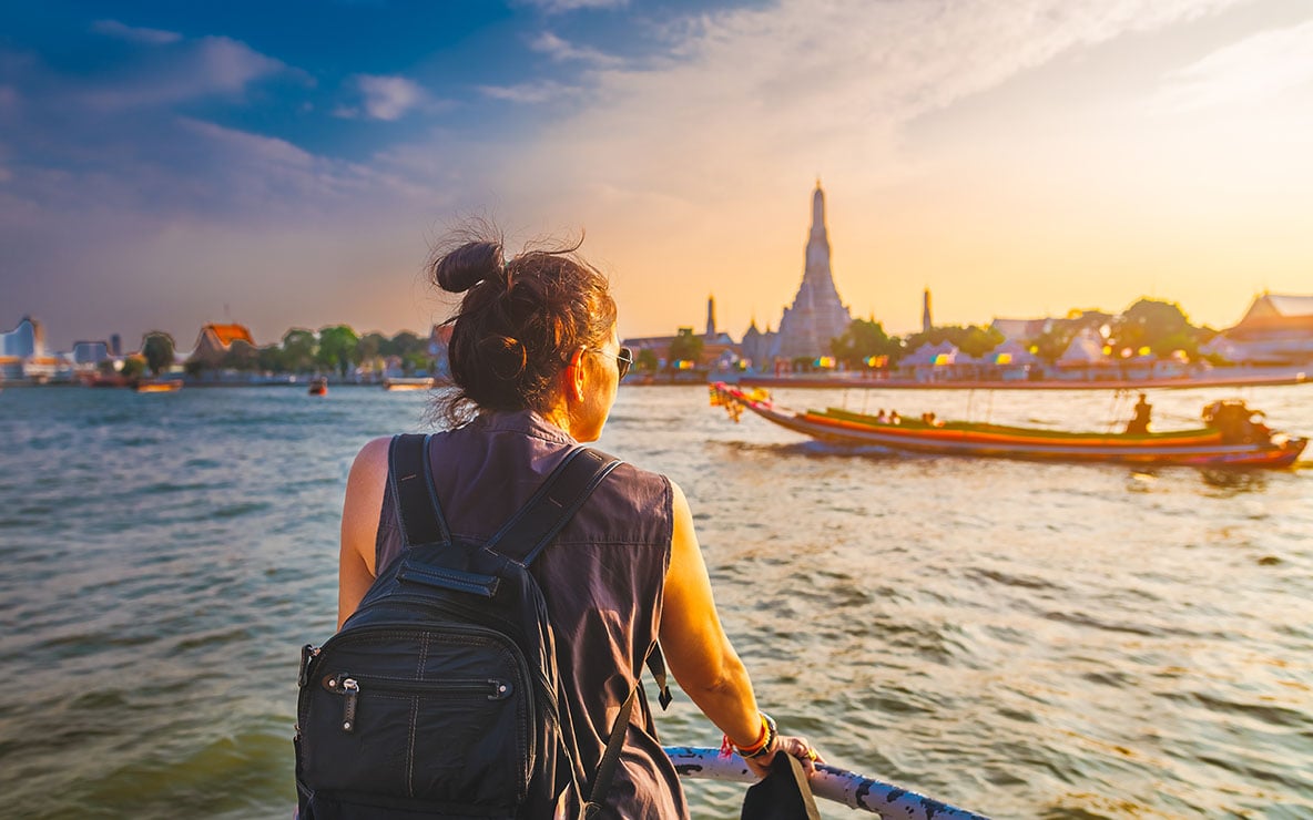 traveler-woman-on-boat-joy-view-wat-arun-at-sunset-