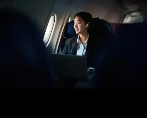 successful-asian-business-woman--business-woman-working-in-airplane-cabin