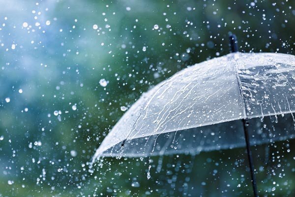 transparent-umbrella-under-rain-against-water-drops-splash-background-Rainy