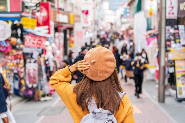 young-woman-traveler-walking-on-the-takeshita-street-in-harajuku