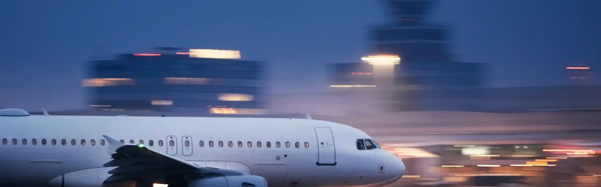 airplane-during-take-off-on-airport-runway-at-night-against