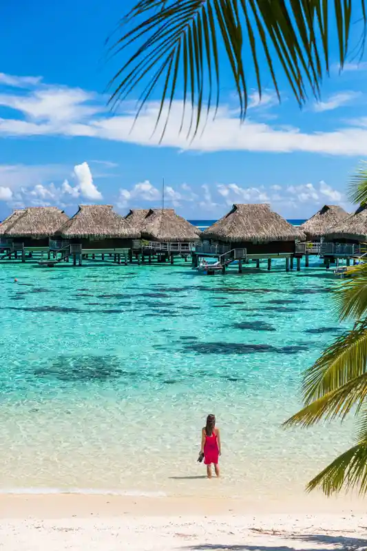 luxury-beach-travel-vacation-woman-in-tahiti-tourist-enjoying-ocean