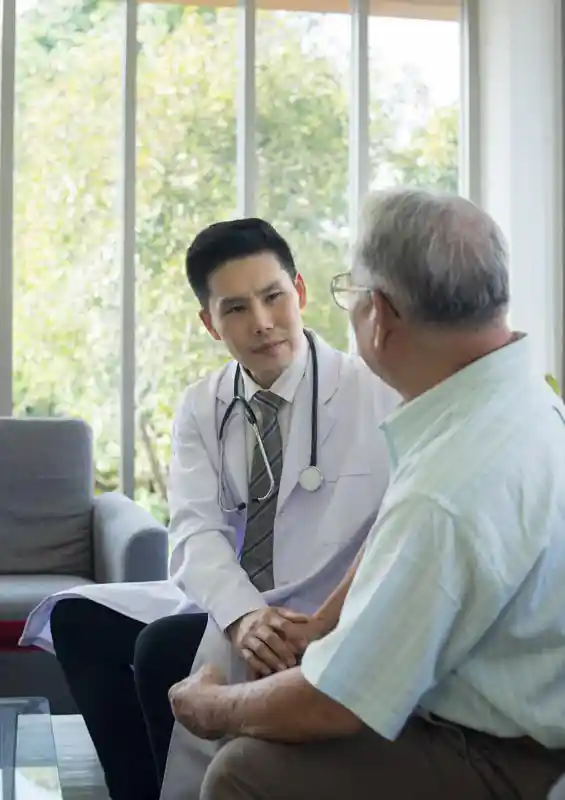 young-asian-doctor-is-discussing-and-consulting-senior-man-in